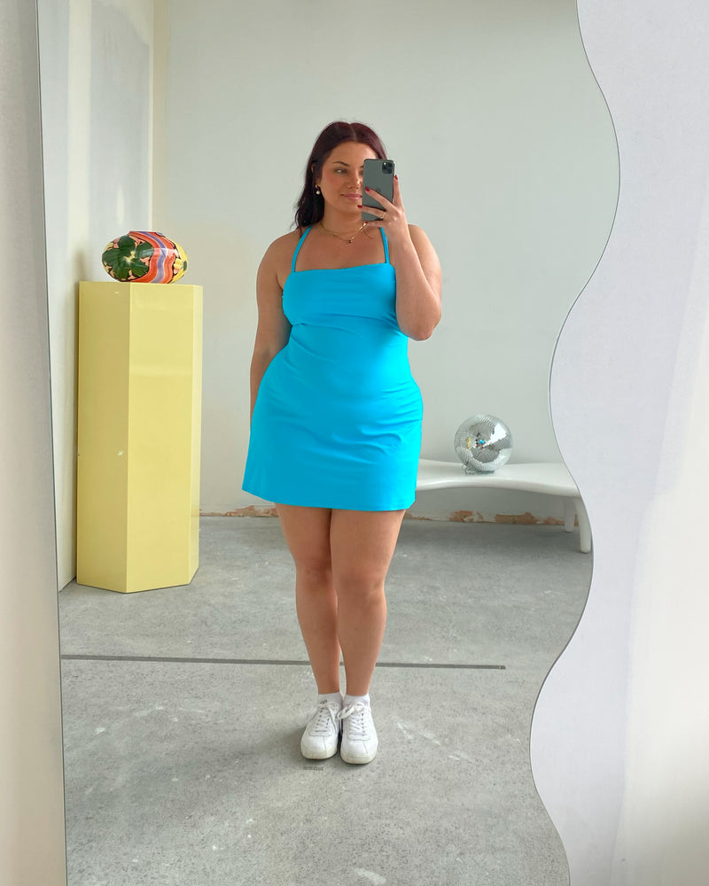 RSR SAMPLE 3516 SNORKEL MINIDRESS | RUBY Sample Snorkel Minidress in aqua. Size 16. One available. Isla is 170cm tall and usually wears a size 16. She measures: BUST: 113cm, WAIST: 100cm, HIP: 129cm