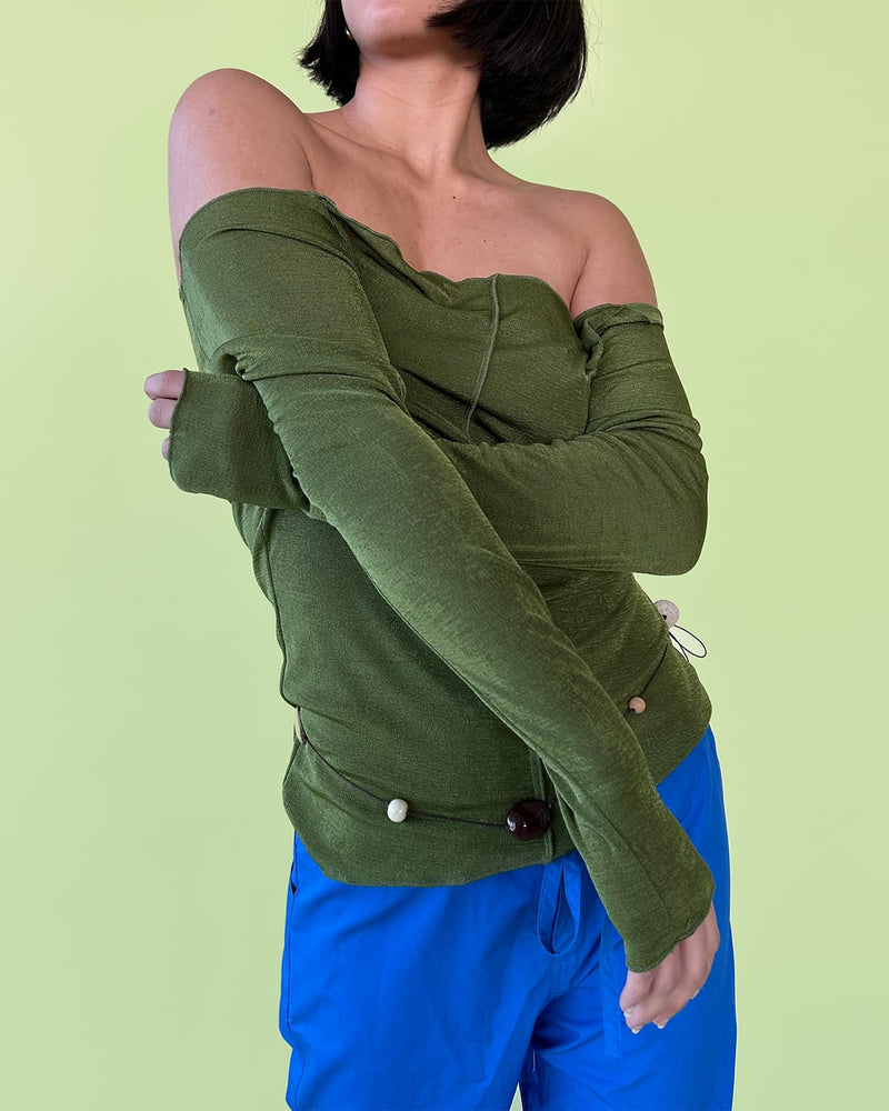 SELINA LONG SLEEVE KHAKI | Long sleeve light-weight knit top imagined in a khaki shade. Selina features an off shoulder silhouette, exposed overlocking and seam down the centre front, adding to the delicate & dreamy...