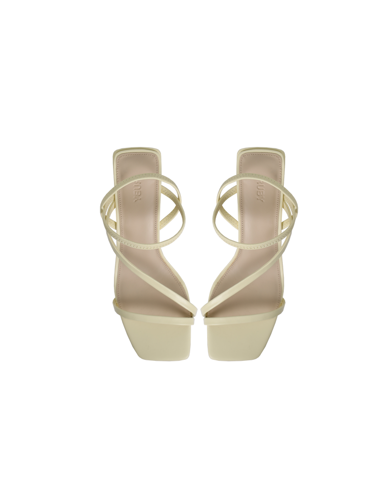 TIA HEEL BUTTER | Square toe heel with straps around the ankle and across the front of the foot. A square block heel adds height but makes these shoes sturdy, while the ankle strap...