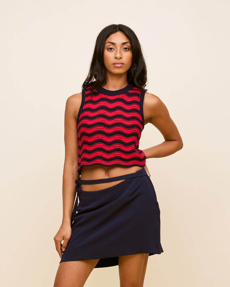 PARADISO TANK NAVY STRAWBERRY | Crochet tank designed in a wavy crochet in a striped navy and strawberry colour way. This tank sits slightly cropped with a high neck.