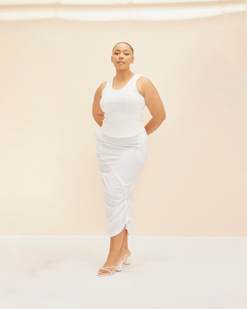 JUPITER TANK IVORY | Corset style tank top designed in a stretch knit fabric with panels through the body and a curved hem and round neckline. A contemporary take on a classic style corset...