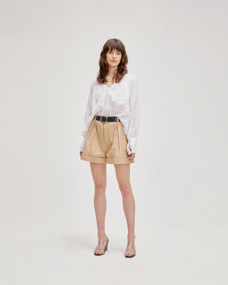 KAI BLOUSE WHITE | Oversized flowy blouse with self-covered button closure at the neckline, made from a delicate translucent ramie voile. Floaty in form, this blouse is that transeasonal staple in your wardrobe.