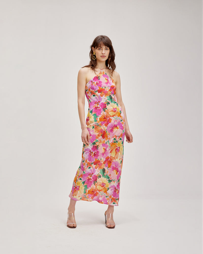 KATA SILK SLIP FLORAL | Bias cut silk slip crafted in a vibrant floral. The high strappy neckline of this piece adds a structured aesthetic to the otherwise soft silhouette.