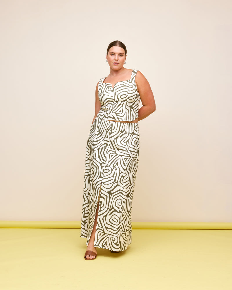 CECE SKIRT MAZE | A-line midi skirt designed in a khaki and cream maze print, printed on a mid-weight cotton drill fabric. This skirt has a front split and panel detailing. Make it a...