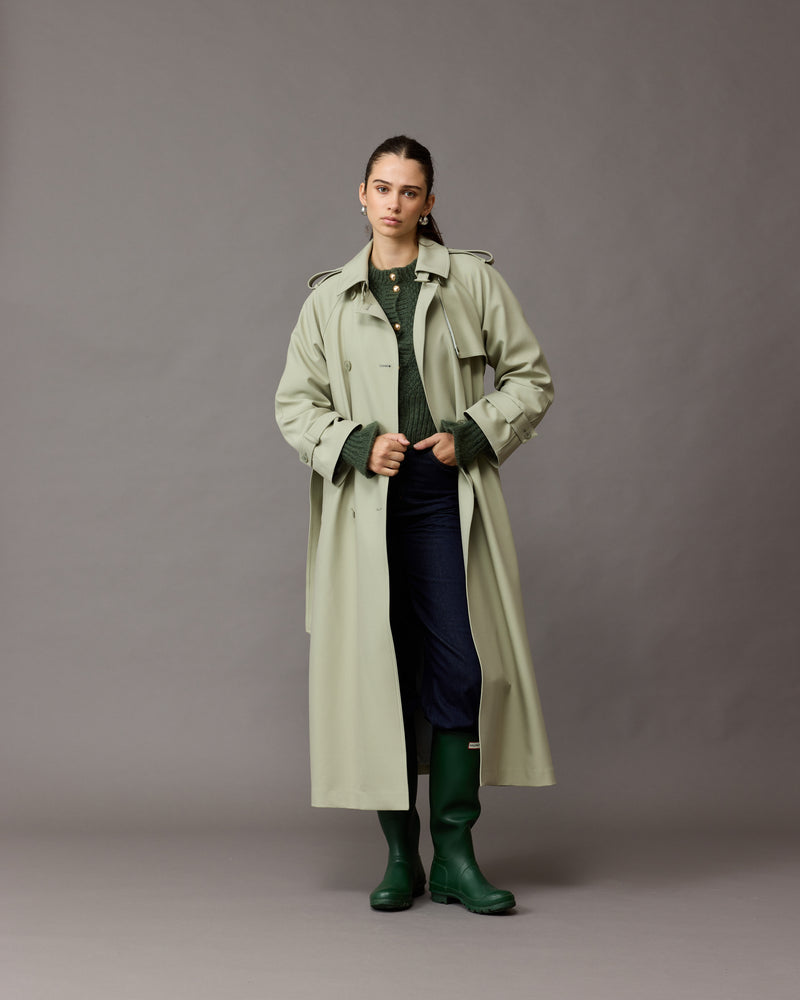 ANNIE TRENCH COAT SAGE | Oversized midi-length trench with a self-fabric belt, button fastenings and, epaulettes at the shoulders and the sleeve. A classic shape imagined in mid-weight sage coloured fabric.