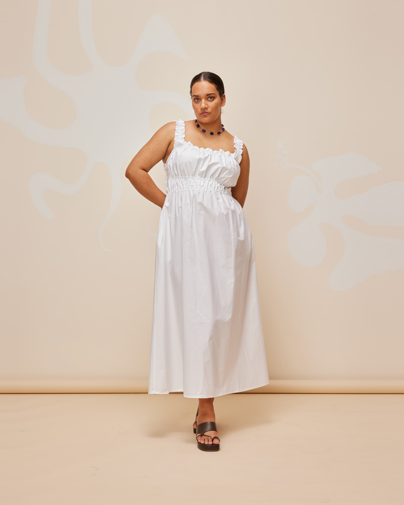 TRULLI DRESS WHITE | Sleeveless cotton midi dress with a square neckline and shirred bodice and straps. This dress falls to a full A-line skirt, that features pockets to house all your essentials.