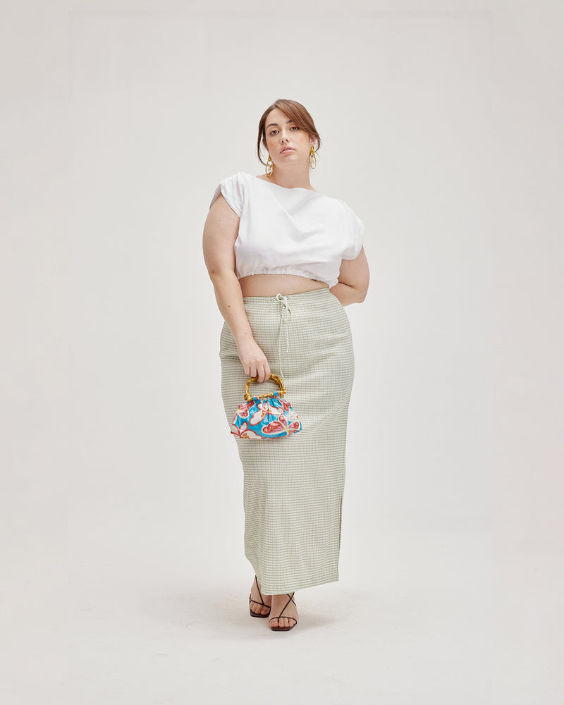 DELPHI GINGHAM SKIRT SAGE GINGHAM | Straight fit maxi skirt with an elasticated waistband that can be cinched in with a tie and a side split on one side. Crafted in a textured gingham with a...