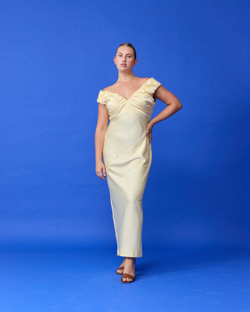 RAQUEL SATIN GOWN BUTTER | Satin slip dress is crafted in a heavy-weight luxe butter fabric, with ruched bust detailing. Wear it on or off the shoulder, either way, this dress is a show stopper.