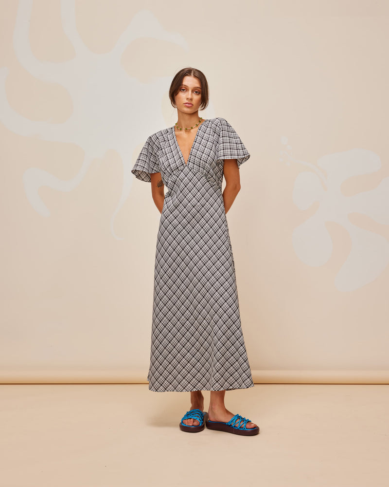  HONEY MIDI DRESS BLACK CHECK | V-neck midi dress, made in a lightweight cotton check. Fitted around the waist flowing to an A-line skirt, this dress is a timeless piece.