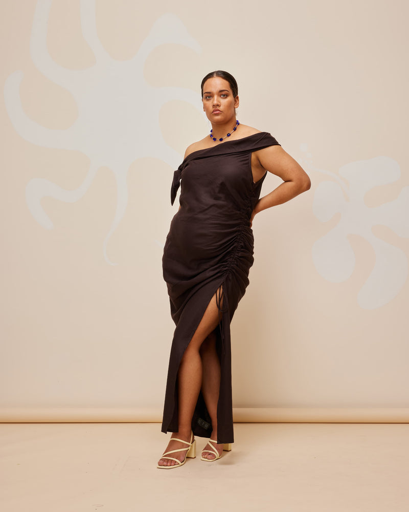 LILY DRESS JAVA | Asymmetrical off-shoulder midi dress with a feature tie at the right shoulder. The side seam drawstring detail is designed to create gathered detailing across the body.