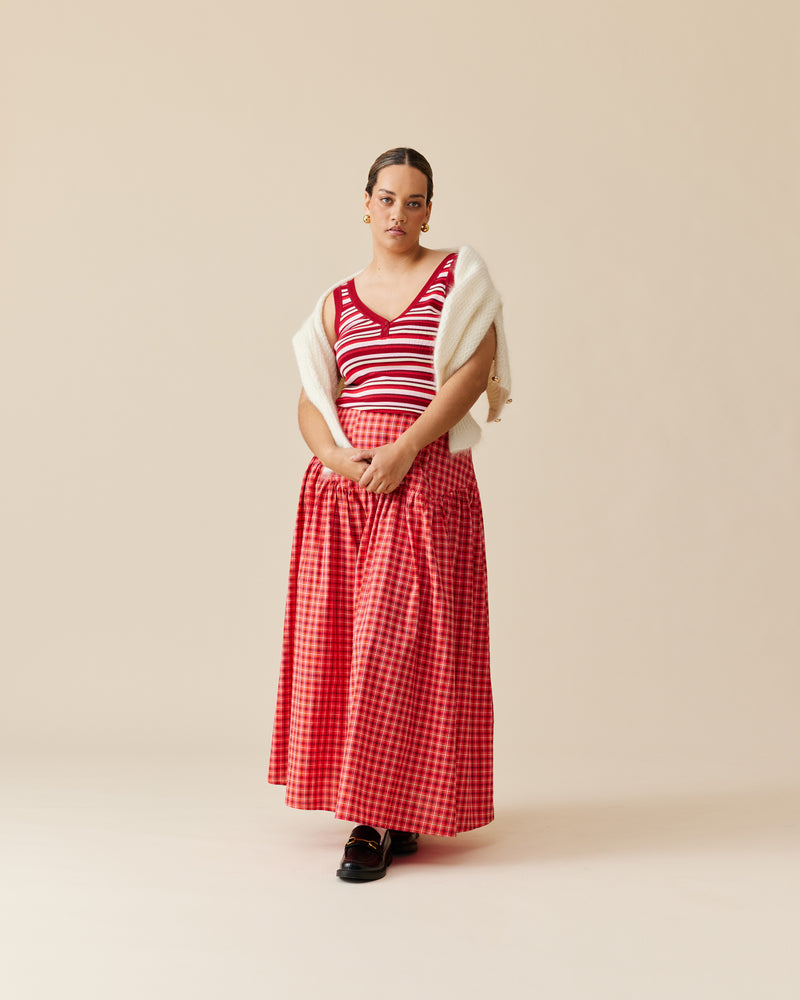 TRULLI SKIRT RED TARTAN | Floaty basque style maxi skirt imagined in a red tartan cotton fabric. This skirt features a bodice-style waistline, that falls to a full, wide skirt.
