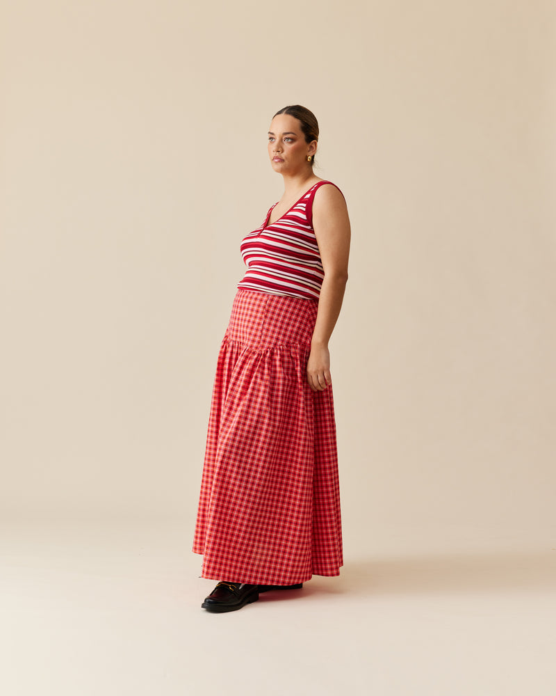 TRULLI SKIRT RED TARTAN | Floaty basque style maxi skirt imagined in a red tartan cotton fabric. This skirt features a bodice-style waistline, that falls to a full, wide skirt.
