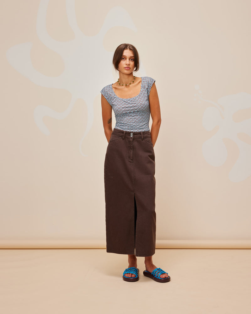 RAFFIA  DENIM SKIRT JAVA | Straight fit midi skirt cut from a mid-weight denim in a washed java colour. A timeless staple that features a front split for movement and pockets to house your essentials.