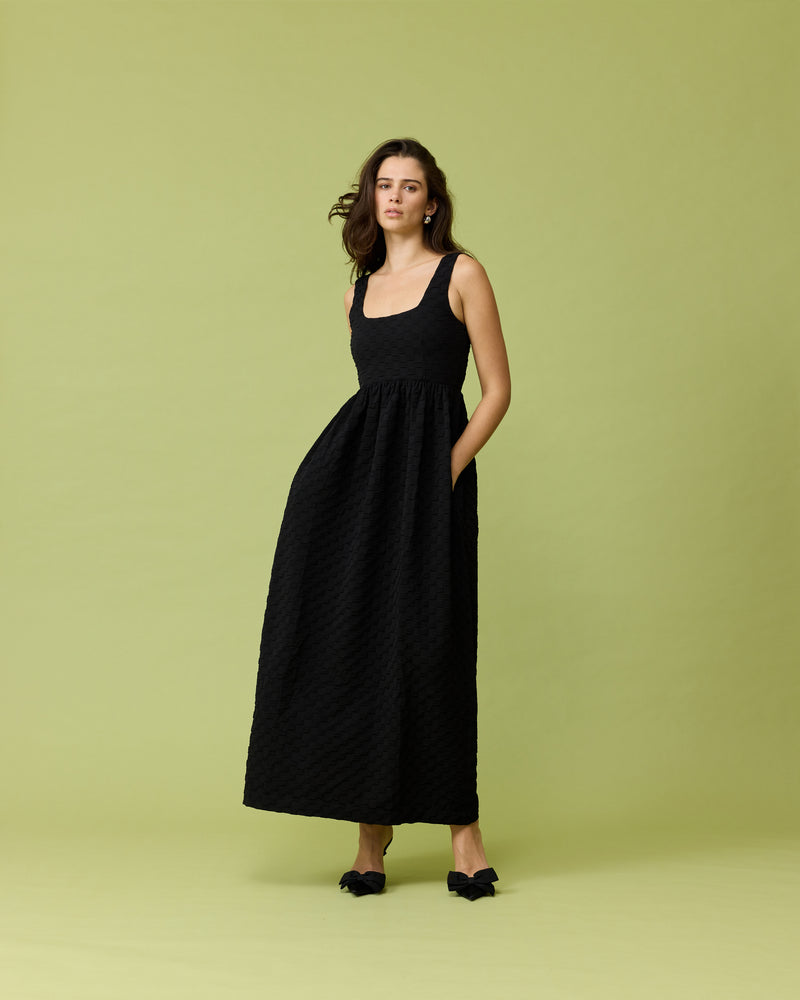 TULIP MAXI DRESS BLACK | Tank-style maxi dress designed in a textured burnout checkered fabric. This dress falls to a floaty A-line maxi skirt, and has pockets for all your essentials.