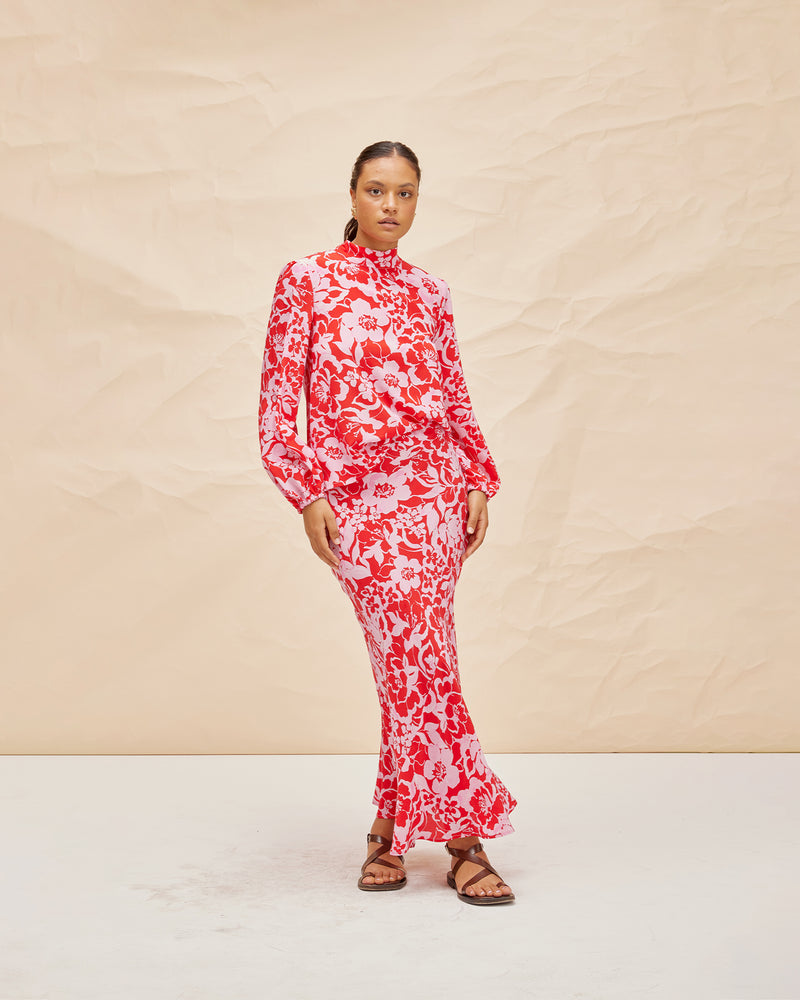 BOBBI SILK BLOUSE CHERRY FLORAL | High neck silk blouse cut in our vibrant cherry floral print. Features a tie at the back neck and elasticated cuffs to give the blouse a relaxed floaty look.
