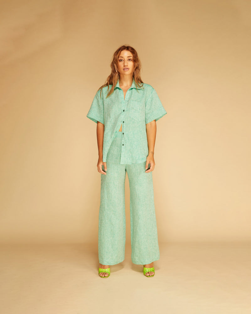 TAI LINEN PANT GREEN MARLE | High waisted, wide leg linen pants with belt loop detail crafted in a new season green marle shade. Sitting flat across the waist they flare slightly at the hem for...