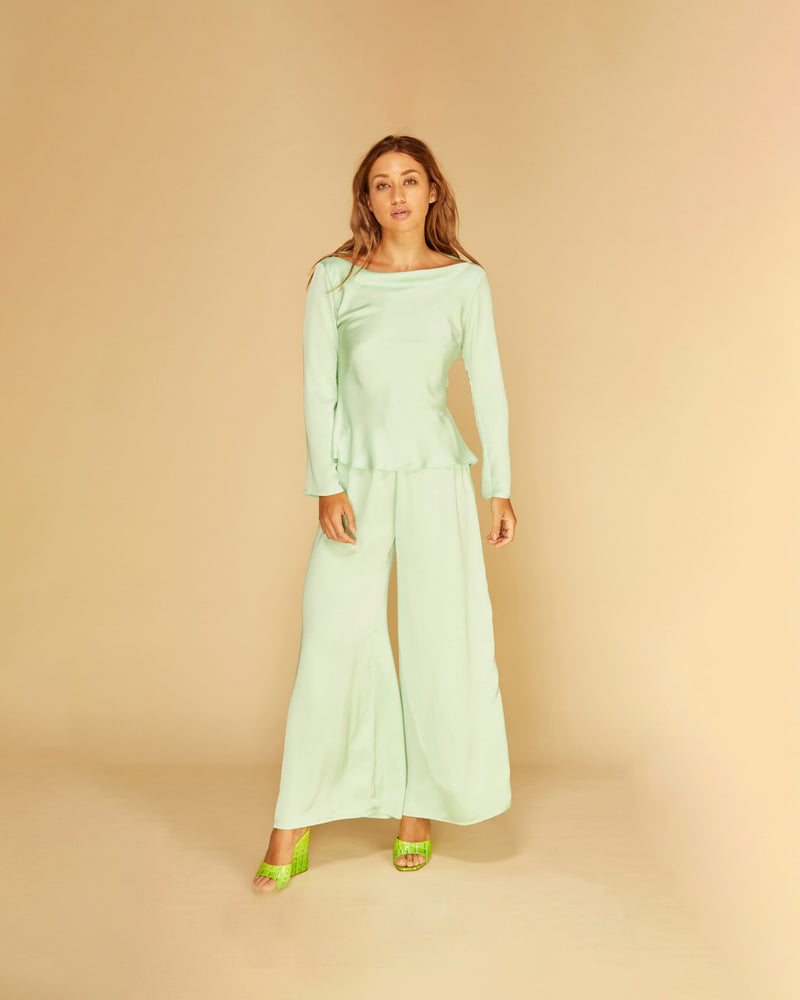 CUCUMBER SATIN PANT MINT | Palazzo style elastic waist pants with a tie, in a luxurious mint coloured satin. These pants are highwaisted, uncomplicated and classically cool.