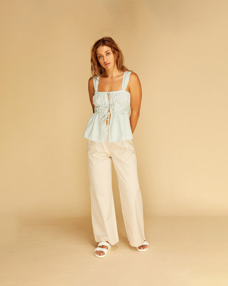 UMA TIE CAMISOLE PALE BLUE | Tie front cami with a gathered bust and wide shoulder straps. An elevated take on a classic cami, this piece is adaptable and can be styled open or tied to...