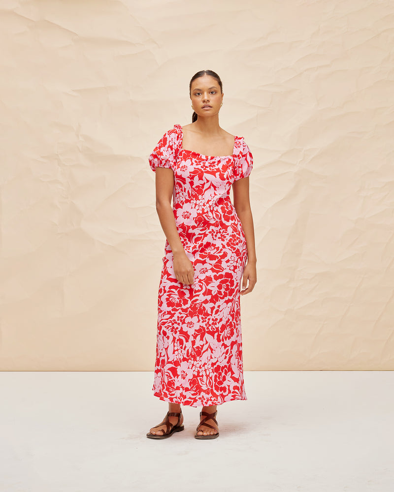 BOBBI SILK MIDI DRESS CHERRY FLORAL | Bias cut silk midi dress designed in our vibrant cherry floral. Features a straight neckline and puff sleeves that compliment the floral print.
