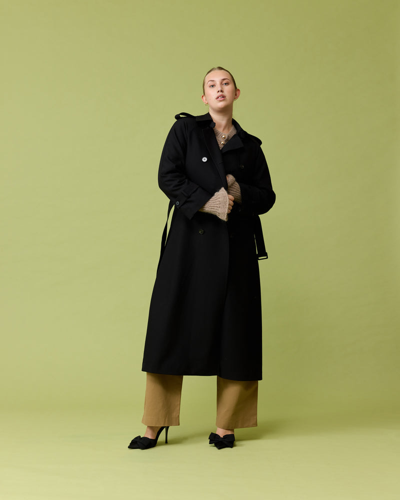 ANNIE TRENCH COAT  BLACK | Oversized midi-length trench with a self-fabric belt, button fastenings and, epaulettes at the shoulders and the sleeve. A classic shape imagined in mid-weight black coloured fabric.
