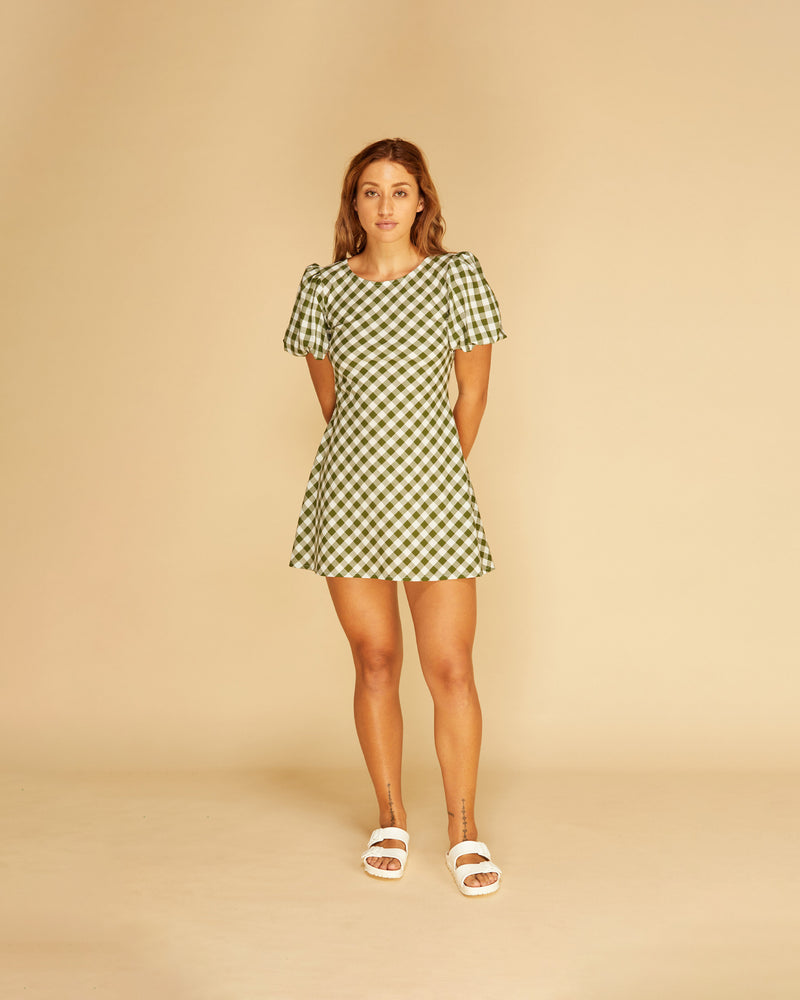 JORDAN GINGHAM MINIDRESS KHAKI GINGHAM | Bias cut cotton minidress with puff sleeves and a keyhole tie closure at the back neck. This piece is the same cut as our much loved Kendall Linen Minidress, reimagined...