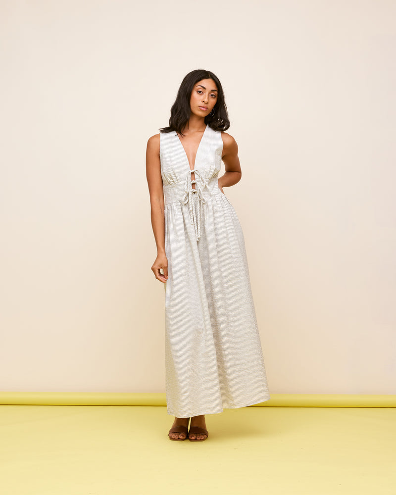 BENNY TIE DRESS WHITE NAVY STRIPE | This dress features a panel detail at the waist two ties and falls into an A-line skirt, giving a floaty, beachy look.