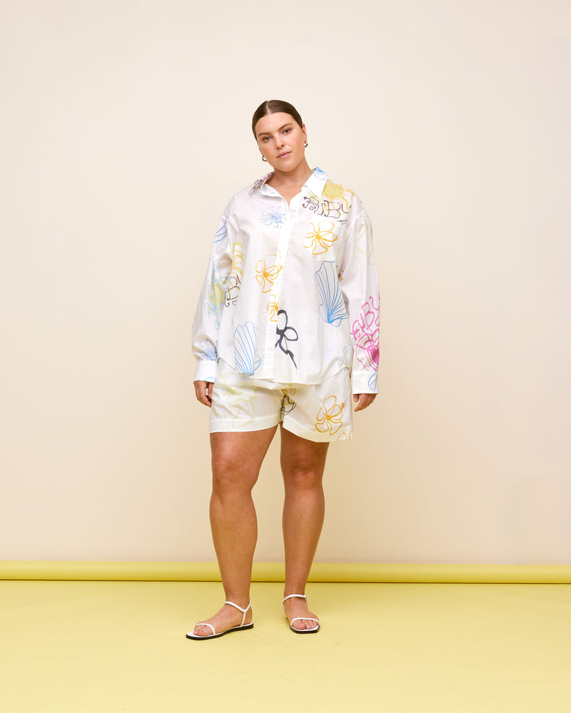 RYDER SHIRT RYDER PRINT | An ode to our much-loved collab with artist Ryder Jones. Longsleeve cotton shirt with printed Resort 23 graphics. The perfect summer layering piece. Make it a set with the Ryder...