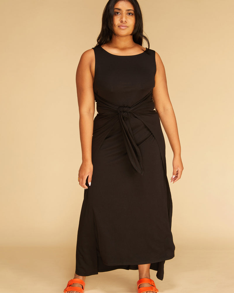 LENI WRAP DRESS BLACK | Boat neck knit maxi dress with wrap tie style front. This is a simple and versatile piece that is elevated by the tie detail, which can be wrapped many different...