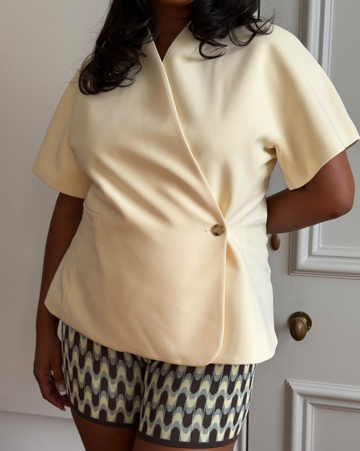 COCO SHORT SLEEVE BLAZER BUTTER | The Coco Blazer now in a short sleeve ~ A collarless blazer designed in a mid-weight suiting fabric. Pair with your favourite denim or suit trouser for an effortlessly polished look.   RUBY Upside Down recognises that nothing is ever...