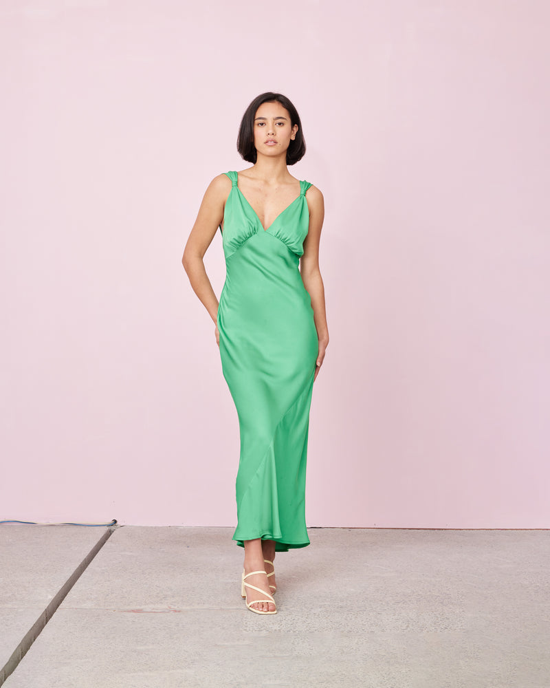 SUBLIME SATIN GOWN PARAKEET | 
Bias cut satin sleeveless gown with a plunge neckline and open back in a luxe parakeet shade. Features a knot detail at the shoulder and gathered detailing at the bust.