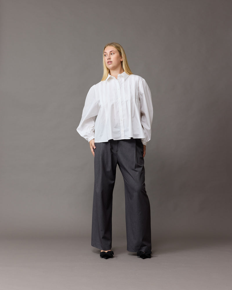 RUE TROUSER CHARCOAL PINSTRIPE | Straight-leg mid-waist suit trouser with a flat waistband and belt loops. These pants are versatile in that they can be worn be easily dressed up or down, to suit any...
