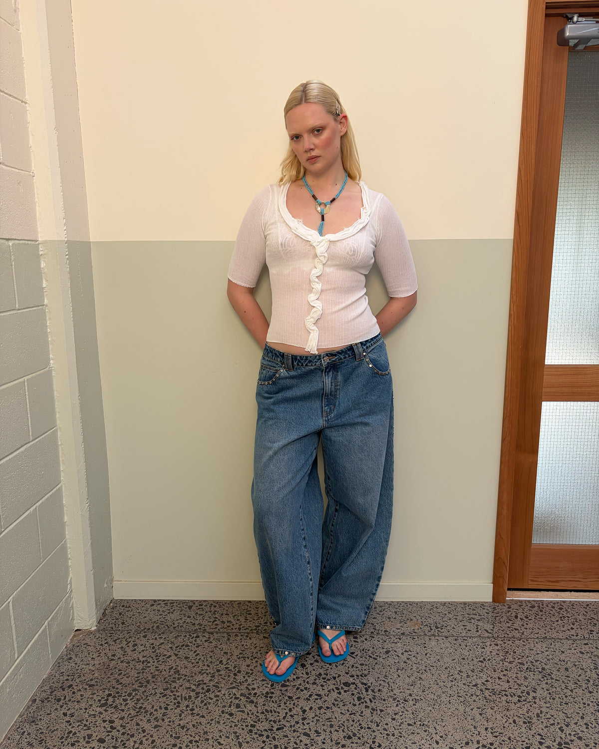 ICON STUDDED JEAN MIDTOWN BLUE | Barrel-leg jean designed in our signature midtown blue wash denim with studded seams. Sits mid to high-waisted with classic 5 pocket and waistband detailing. An updated version of our Icon Jean.