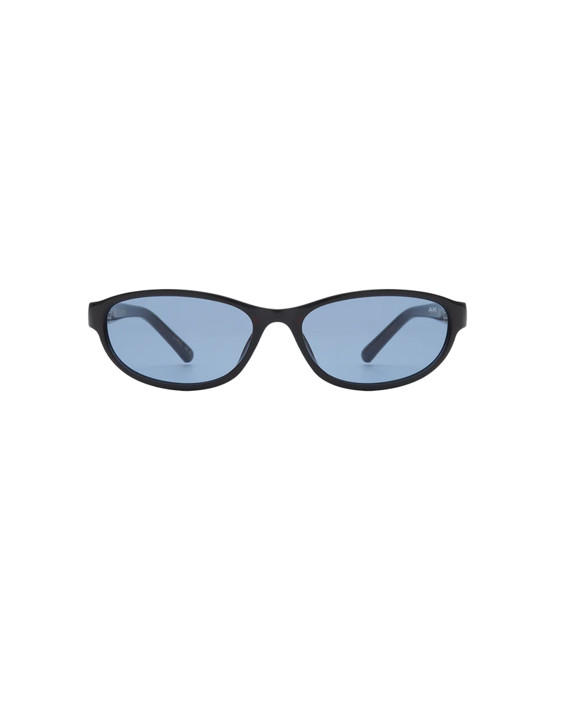 ALEXA SUNGLASS DEMI TORTOISE | Slim sunglasses with a futuristic and refined expression. Designed with a brown cat-eye shape lens and demi-tortoise frames.
