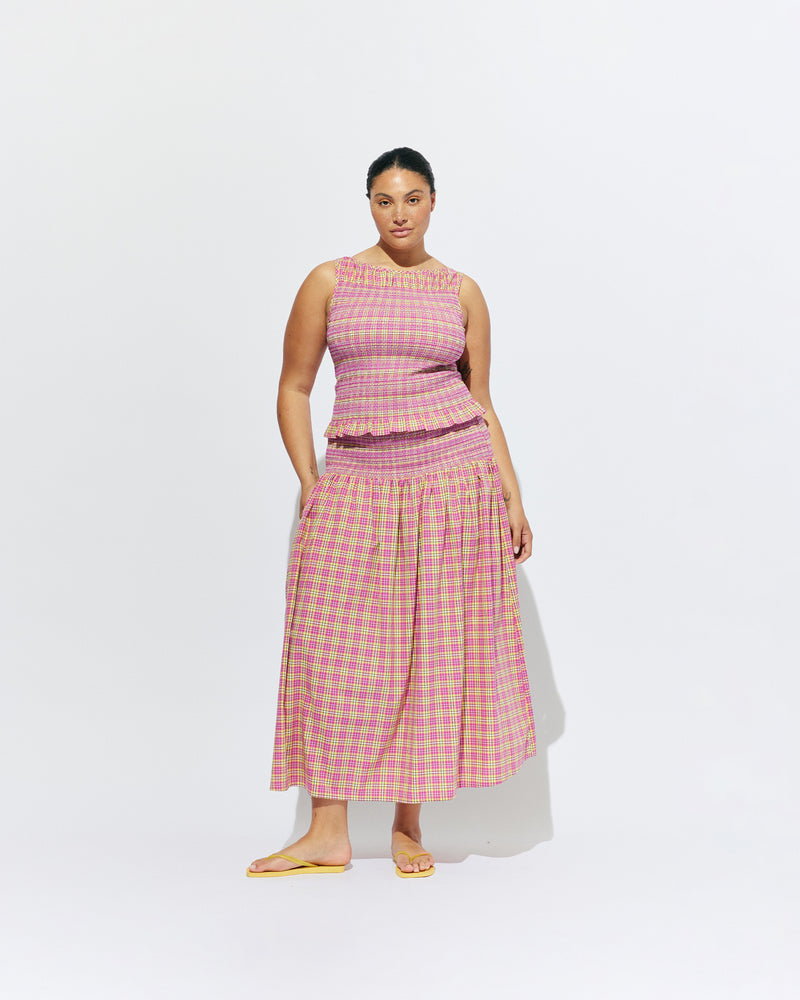 ANASTASIA SKIRT PINK YELLOW TARTAN | Cotton maxi skirt designed in a pink yellow tartan and crafted in 100% organic cotton, with a shirred waist and hip that falls to a floaty, full skirt. This skirt can be worn as a pop of colour paired with...
