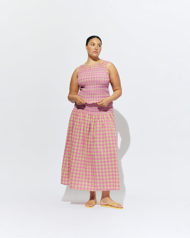 ANASTASIA TANK PINK YELLOW TARTAN | Sleeveless tank with smocking throughout the body to create texture and shape, designed in a pink yellow tartan and crafted in 100% organic cotton,. Features a soft ruffle at the hem, which complements the smocking detail. Make it a set...