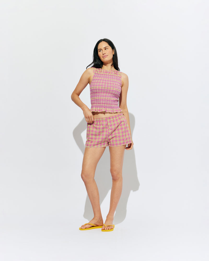 ANASTASIA TANK PINK YELLOW TARTAN | Sleeveless tank with smocking throughout the body to create texture and shape, designed in a pink yellow tartan and crafted in 100% organic cotton,. Features a soft ruffle at the hem, which complements the smocking detail. Make it a set...