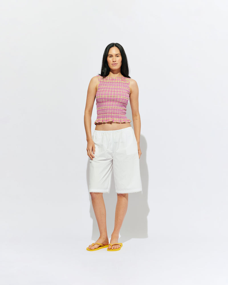 STEVIE COTTON SHORT WHITE | Longline short designed in a crisp white organic cotton, with scalloped pico trim detailing along the hem. Pair with one of our Rudi Tanks for an elevated everyday look, or wear with the Carolyn Blazer as a summer-friendly workwear short. 