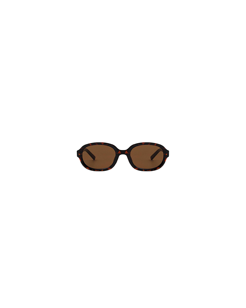 STELLA SUNGLASS LB TRANSPARENT | The Stella by A.Kjaerbede is an exaggerated cat eye sunglass with light brown frames and brown tinted lens. The lens have UV400 protection. Each pair of sunglasses come with a cleaning pouch.