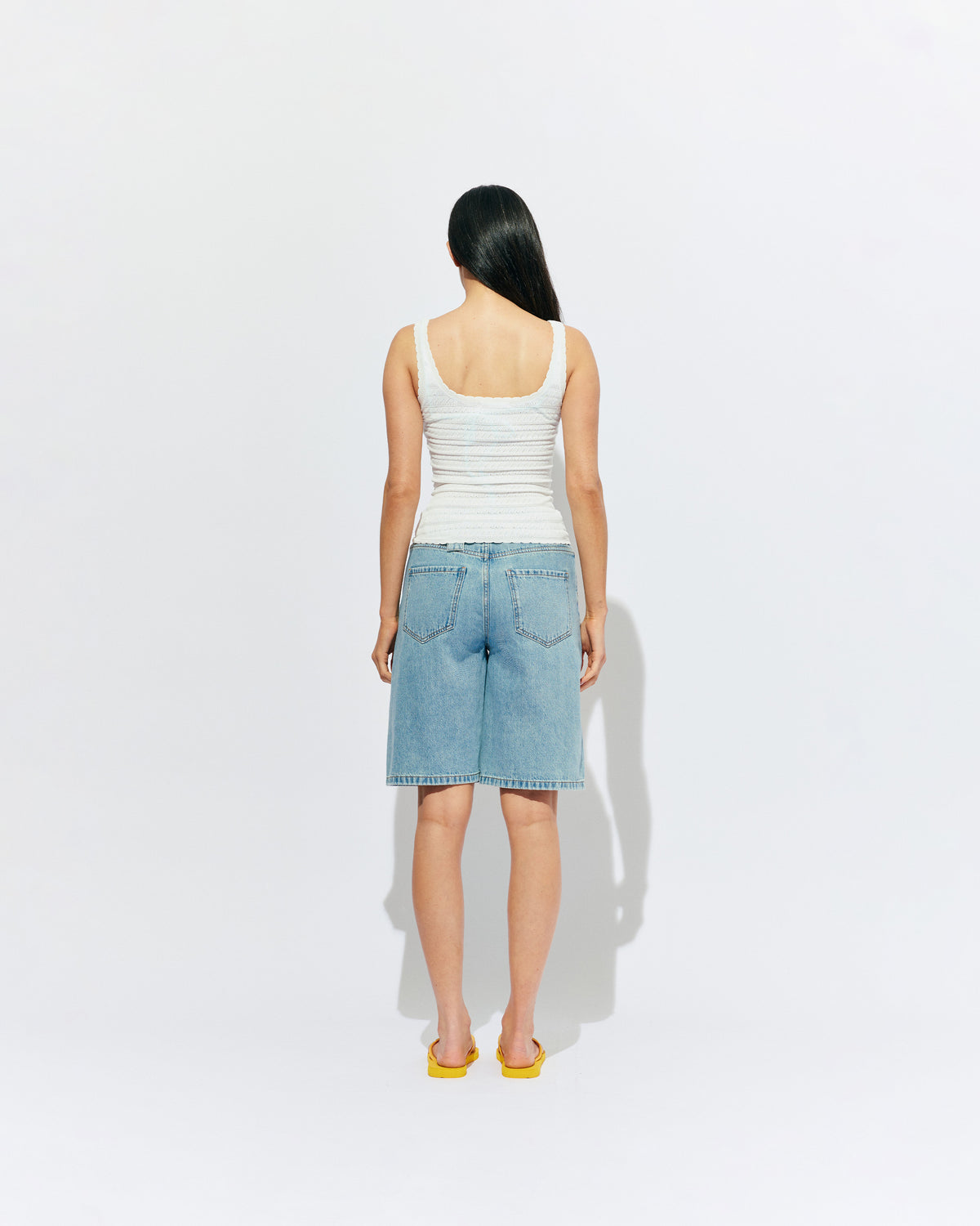 BAMBI TANK WHITE | An update on our Rubette favourite Beau Tank, the Bambi tank features a scoop neck design, in a lightweight white knit. Make it a matching set with the Bambi Cardigan or pair with your favourite shorts.