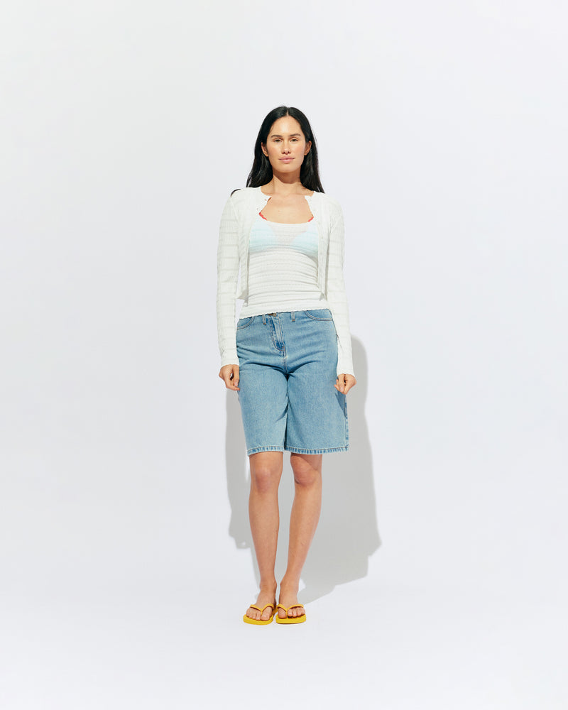 BAMBI CARDIGAN WHITE | An update on our Rubette favourite Beau Cardigan, the Bambi cardigan sits cropped with a high neckline, designed in a lightweight white knit. Make it a matching set with the Bambi Tank or pair with your favourite denim shorts.