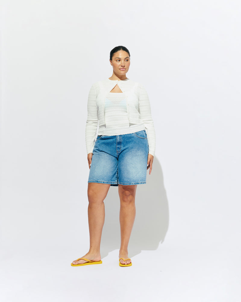 BAMBI CARDIGAN WHITE | An update on our Rubette favourite Beau Cardigan, the Bambi cardigan sits cropped with a high neckline, designed in a lightweight white knit. Make it a matching set with the Bambi Tank or pair with your favourite denim shorts.