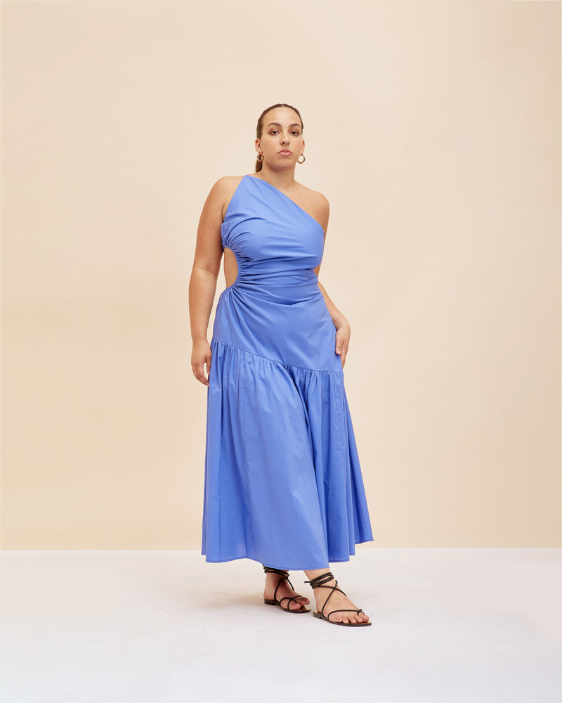 BETTINA CUT OUT DRESS PERIWINKLE | Asymmetrical one shoulder midi dress with a circular cut-out at waist in a striking Baja blue cotton. This dress is designed to be a stand out.