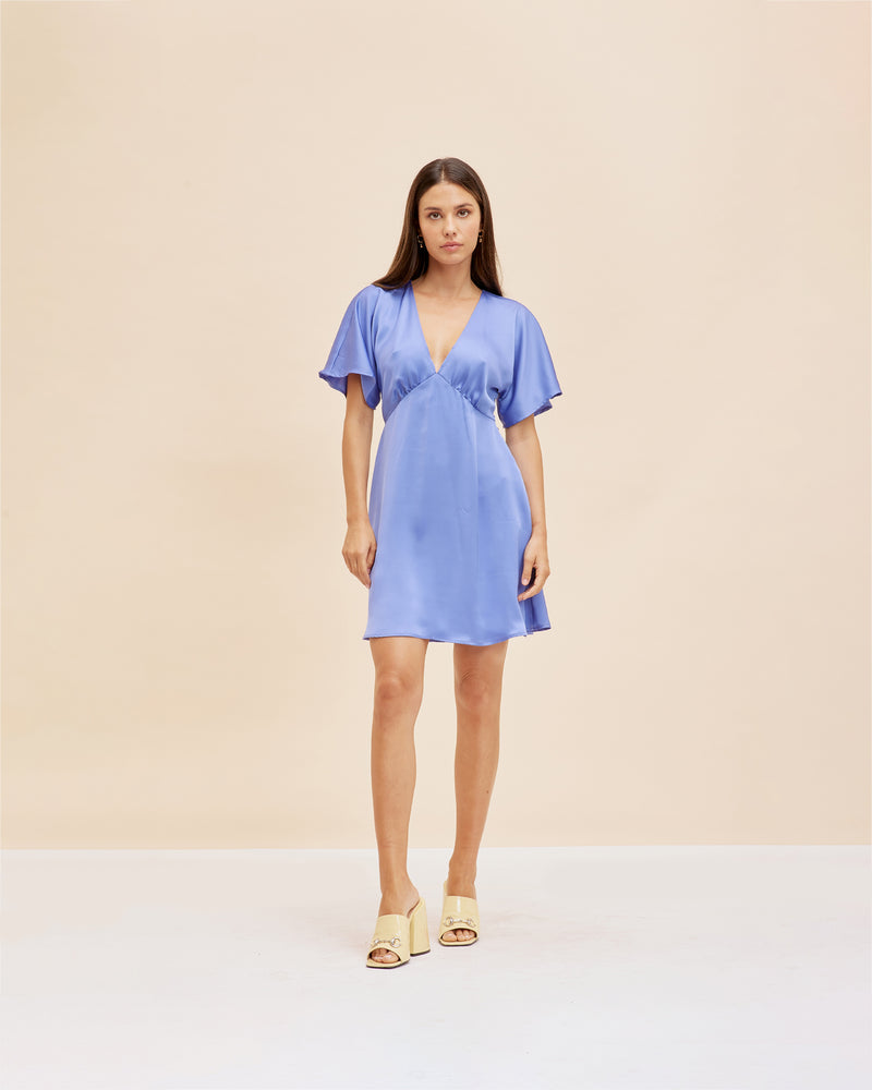 BETTINA SATIN MINIDRESS PERIWINKLE | V-neck minidress with short flute sleeves in a lush periwinkle satin. Seam detail under the bust and a waist tie means this dress fits to perfection.