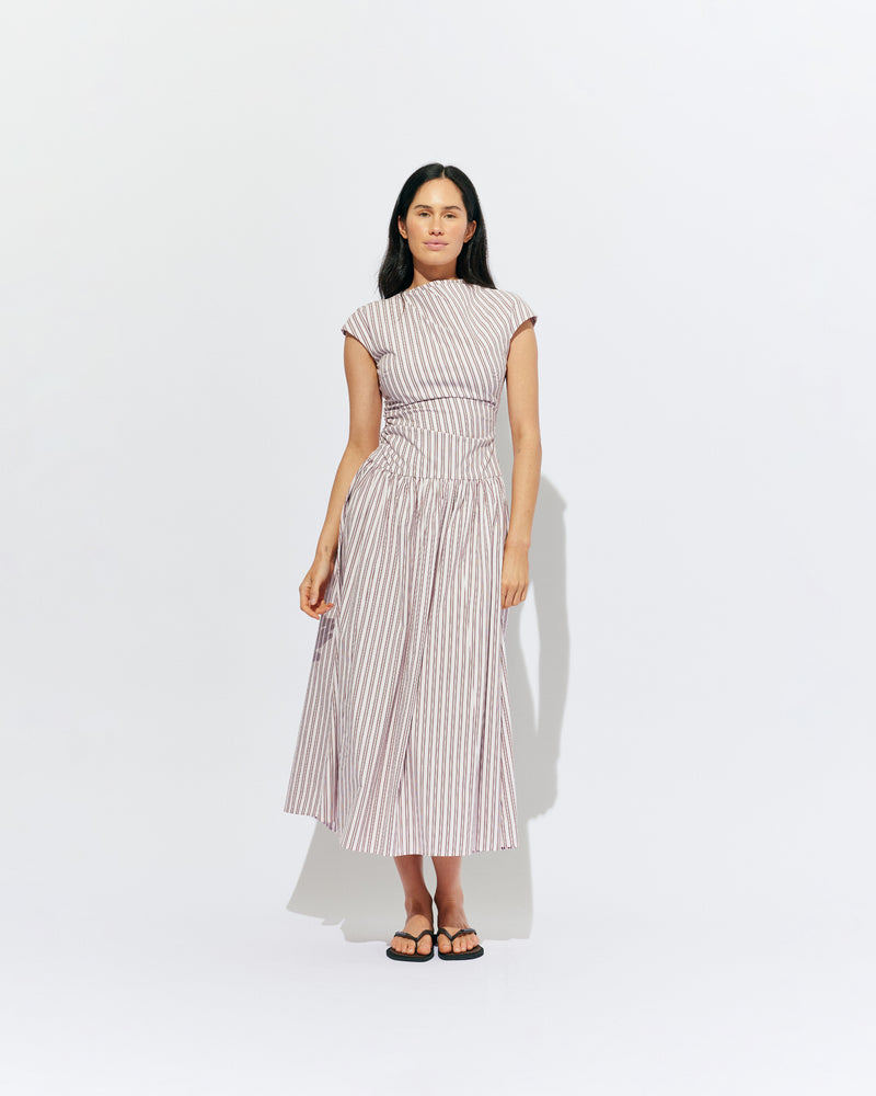 BIRDIE MAXI DRESS PINK LADY STRIPE | Drop waist maxi dress designed in our organic cotton pink lady stripe. Featuring a high neck collar, pleated skirt and a gather detail on the lower back designed for better fit and movement. Layer with one of our Blazers for...