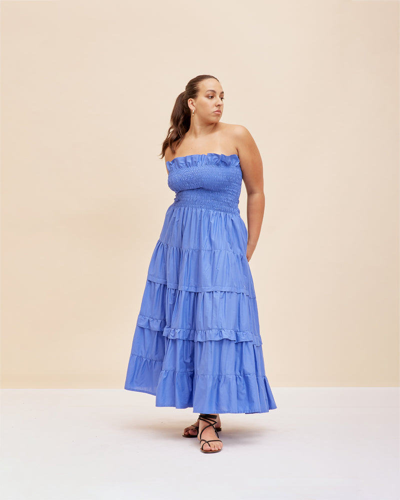 BIRD MAXI DRESS PERIWINKLE | Strapless maxi dress with a shirred bodice for a close and flexible fit, and skirt that falls in loose tiers. The contrast of the fitted bodice against the flared skirt...