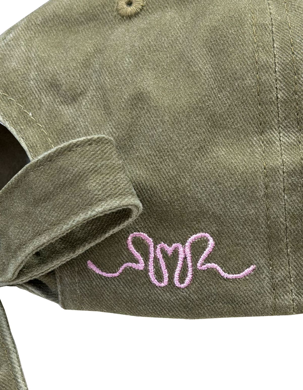 BOW CAP OLIVE | The perfect finishing touch to any outfit, introducing our new Bow Cap in olive. A RUBY twist on your standard cap, with an adjustable tie featured at the back and our femme logo embroidered in pink on the side.