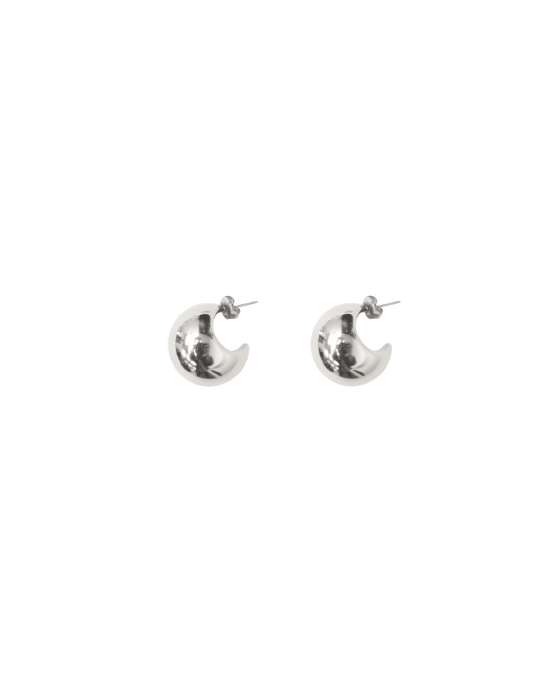 CARMELA EARRING SILVER | Chunky crescent-style studs designed in a silver colour. The Carmela Earrings are 1cm wide. 