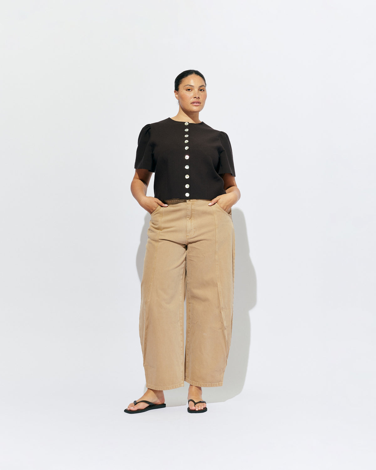 BUZZ JEAN SANDWASH | Your new everyday go-to, the Buzz Jean is a barrel-leg style pant, designed in a sandwash denim. Sits mid-waisted and features panel detailing down the front that wraps to the side seam.