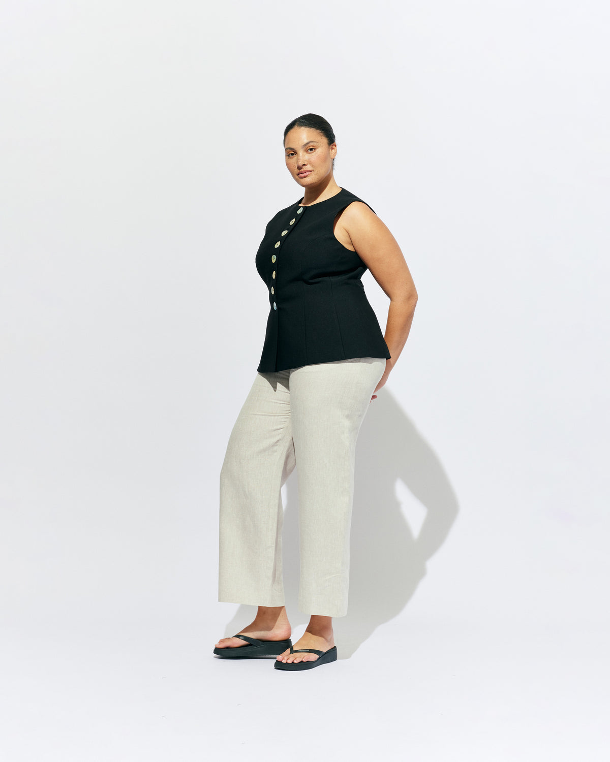 CAROLYN LINEN PANT NATURAL | Classic high waisted linen pant with an elevated twist ~ straight leg silhouette, designed in a lightweight natural linen and with feature shell buttons along the pockets. Pair it with our Carolyn Vest for the ultimate power suit moment in your...