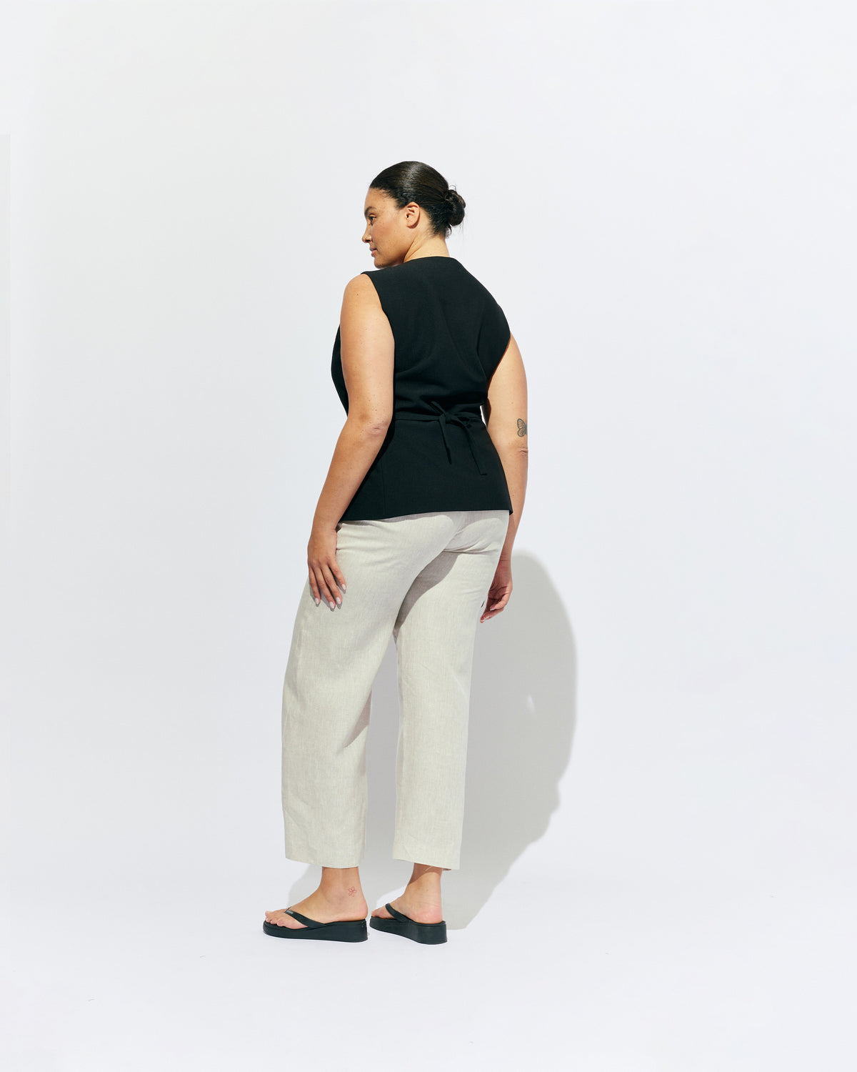 CAROLYN LINEN PANT NATURAL | Classic high waisted linen pant with an elevated twist ~ straight leg silhouette, designed in a lightweight natural linen and with feature shell buttons along the pockets. Pair it with our Carolyn Vest for the ultimate power suit moment in your...